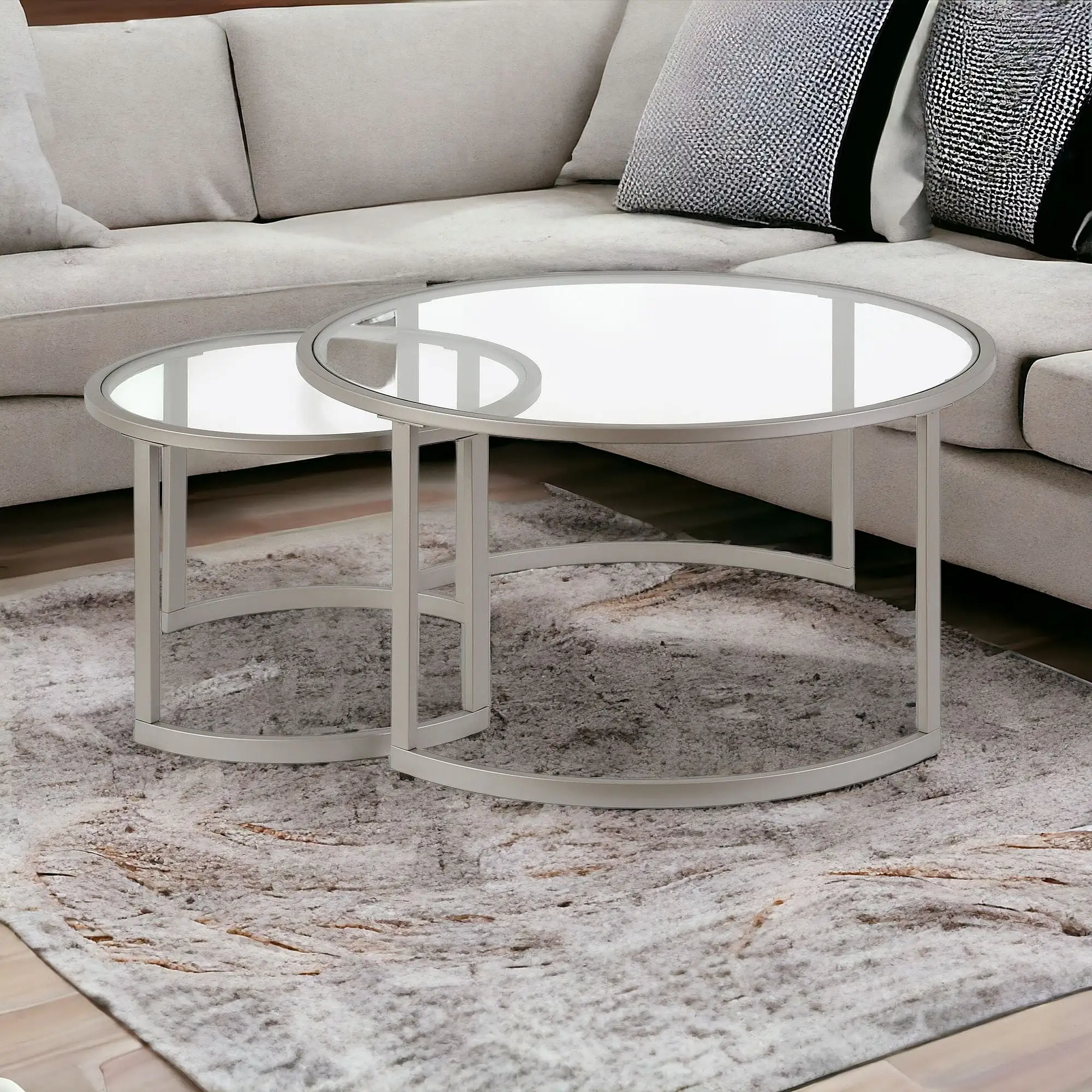 Set of Two 36 Nickel Glass And Steel Round Nested Coffee Tables