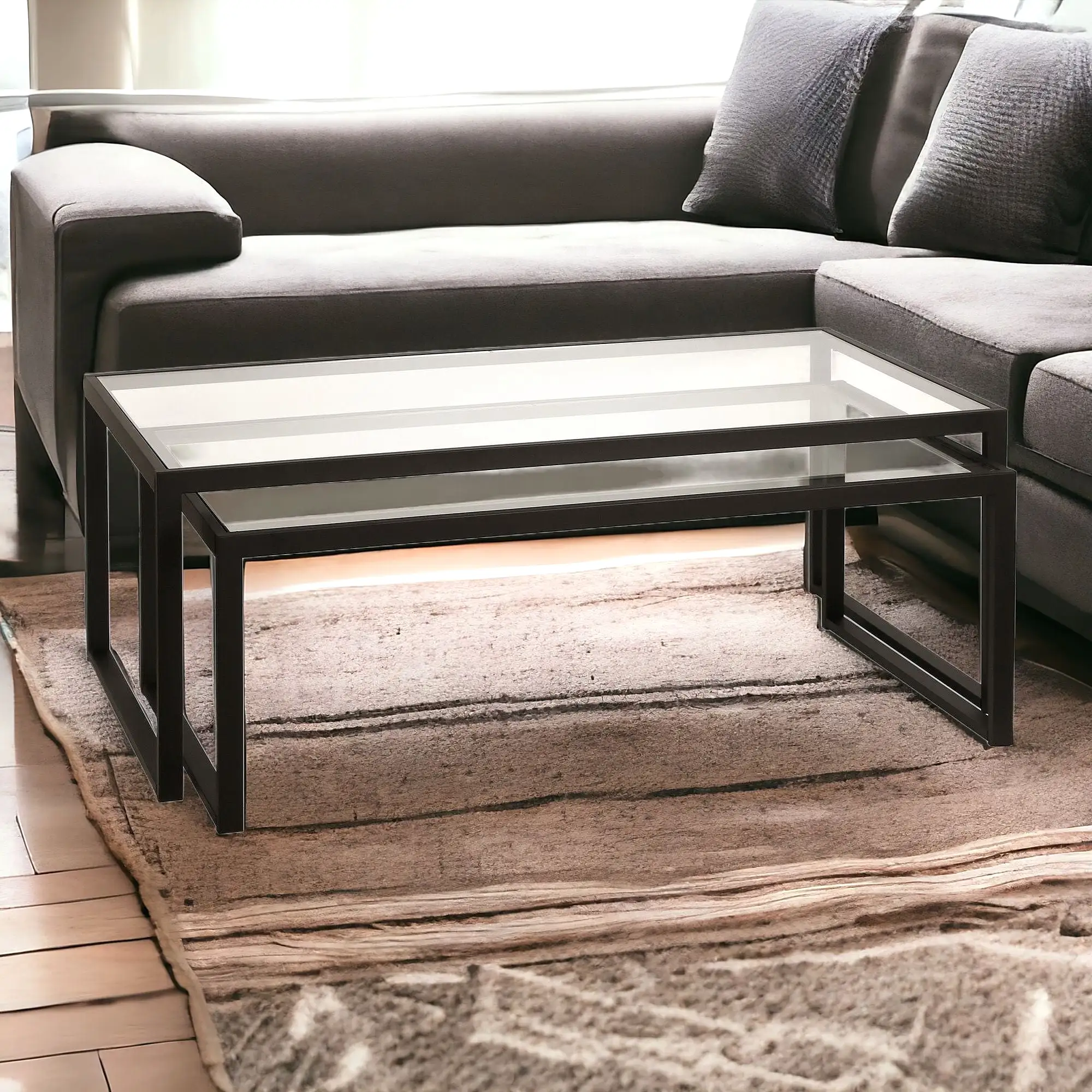 Set of Two 46 Black Glass And Steel Nested Coffee Tables